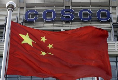 A Chinese national flag flies in front of COSCO's headquarters in Beijing August 26, 2010. REUTERS/Barry Huang A Chinese national flag flies in front of COSCO's headquarters in Beijing August 26, 2010. REUTERS/Barry Huang