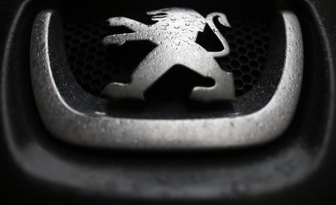 Raindrops are seen on a Peugeot car parked in Paris, January 9, 2013. REUTERS/Christian Hartmann Raindrops are seen on a Peugeot car parked in Paris, January 9, 2013. REUTERS/Christian Hartmann