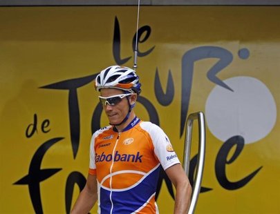 Rabobank rider Grischa Niermann of Germany arrives at the sign-in podium with a fake antenna on his helmet before the start of the tenth sta Rabobank rider Grischa Niermann of Germany arrives at the sign-in podium with a fake antenna on his helmet before the start of the tenth sta