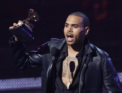 Chris Brown accepts the award for best R&B album for "F.A.M.E." at the 54th annual Grammy Awards in Los Angeles, California, February 12, 20 Chris Brown accepts the award for best R&B album for "F.A.M.E." at the 54th annual Grammy Awards in Los Angeles, California, February 12, 20