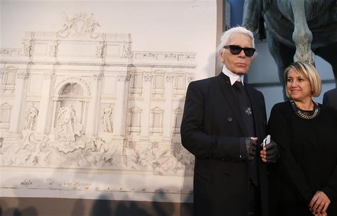 German designer Karl Lagerfeld (L) and Creative Director of Fendi, Silvia Fendi arrive to attend a news conference to present a project of c German designer Karl Lagerfeld (L) and Creative Director of Fendi, Silvia Fendi arrive to attend a news conference to present a project of c
