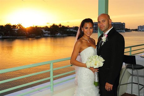 Lazaro Sopena poses with Hann Dinh on their wedding day in Miami Beach, Florida, in this July 2, 2011 handout photo. Sopena opted to take hi Lazaro Sopena poses with Hann Dinh on their wedding day in Miami Beach, Florida, in this July 2, 2011 handout photo. Sopena opted to take hi
