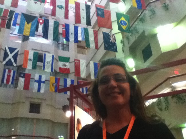 Charli with the flags of the nations of St. Jude Children's Hospital patients