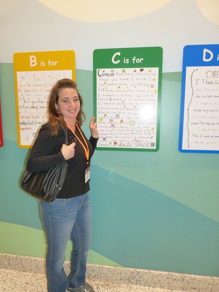 Charli McKenzie at the Alphabet Wall, a collection of thoughts and poems from patients and families... one for each letter of the alphabet.