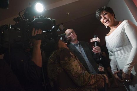 TV personality Kris Jenner (R) talks with reporters as she arrives for a party thrown by Google and the Hollywood Reporter, on the eve of th TV personality Kris Jenner (R) talks with reporters as she arrives for a party thrown by Google and the Hollywood Reporter, on the eve of th