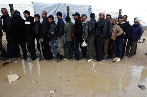 Syrian refugees wait to receive humanitarian aid during a visit by Anne C. Richard, assistant secretary of state for population, refugees, a Syrian refugees wait to receive humanitarian aid during a visit by Anne C. Richard, assistant secretary of state for population, refugees, a