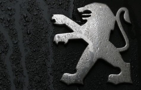 Raindrops are seen on a Peugeot car parked in Paris, January 9, 2013. REUTERS/Christian Hartmann Raindrops are seen on a Peugeot car parked in Paris, January 9, 2013. REUTERS/Christian Hartmann