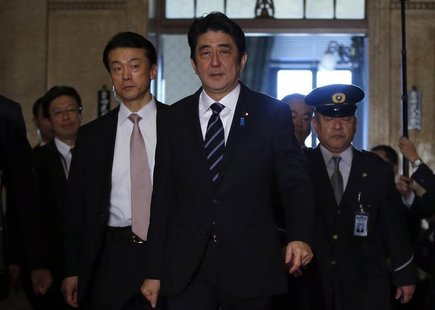 Japan's Prime Minister Shinzo Abe walks to an ordinary session at the lower house of parliament in Tokyo January 28, 2013. REUTERS/Toru Hana Japan's Prime Minister Shinzo Abe walks to an ordinary session at the lower house of parliament in Tokyo January 28, 2013. REUTERS/Toru Hana