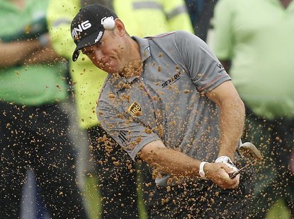 Lee Westwood of England plays a shot out of the bunker on the 14th hole during the final of the 2012 Nedbank Golf Challenge in Sun City, in Lee Westwood of England plays a shot out of the bunker on the 14th hole during the final of the 2012 Nedbank Golf Challenge in Sun City, in