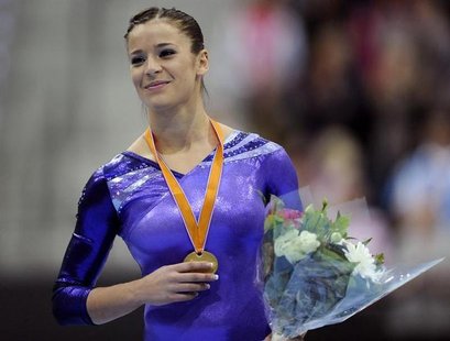 Alicia Sacramone of the U.S. celebrates on the podium with her gold medal after winning the women's vault finals at the Artistic Gymnastics Alicia Sacramone of the U.S. celebrates on the podium with her gold medal after winning the women's vault finals at the Artistic Gymnastics