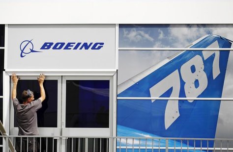 A worker prepares the Boeing chalet ahead of the Farnborough Airshow 2012 in southern England July 8, 2012. REUTERS/Luke MacGregor A worker prepares the Boeing chalet ahead of the Farnborough Airshow 2012 in southern England July 8, 2012. REUTERS/Luke MacGregor