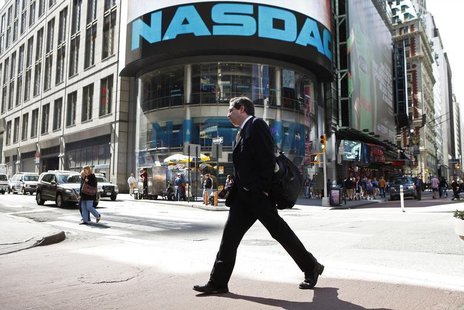 A pedestrian walks past the NASDAQ building in New York City, April 30, 2010. REUTERS/Lucas Jackson A pedestrian walks past the NASDAQ building in New York City, April 30, 2010. REUTERS/Lucas Jackson