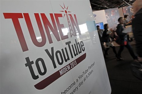 Visitors walk past a YouTube stand during the International Record Music Publishing and Video Music Market (MIDEM) in Cannes January 27, 201 Visitors walk past a YouTube stand during the International Record Music Publishing and Video Music Market (MIDEM) in Cannes January 27, 201