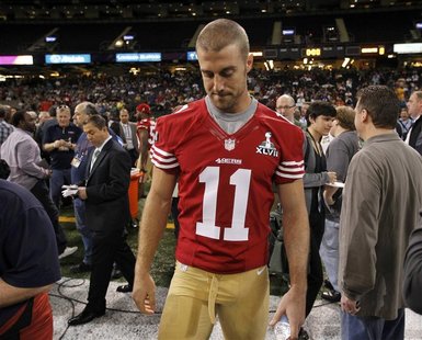 San Francisco 49ers quarterback Alex Smith walks on the field after he was not given a booth to answers question from journalists during Med San Francisco 49ers quarterback Alex Smith walks on the field after he was not given a booth to answers question from journalists during Med