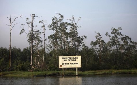 A warning sign belonging to the company Royal Dutch Shell is seen along the Nembe creek in Nigeria's oil state of Bayelsa December 2, 2012. A warning sign belonging to the company Royal Dutch Shell is seen along the Nembe creek in Nigeria's oil state of Bayelsa December 2, 2012.
