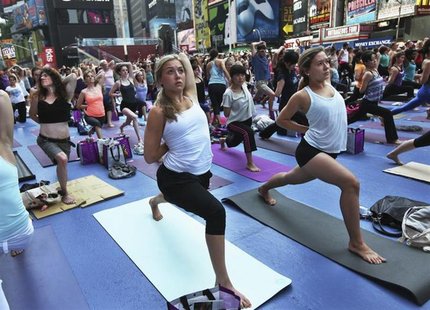 People practice yoga on the morning of the summer solstice in New York's Times Square June 20, 2012. REUTERS/Shannon Stapleton People practice yoga on the morning of the summer solstice in New York's Times Square June 20, 2012. REUTERS/Shannon Stapleton