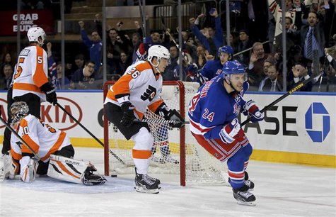 New York Rangers right wing Ryan Callahan (24) celebrates in front of Philadelphia Flyers left wing Ruslan Fedotenko (26) and goalie Ilya Br New York Rangers right wing Ryan Callahan (24) celebrates in front of Philadelphia Flyers left wing Ruslan Fedotenko (26) and goalie Ilya Br