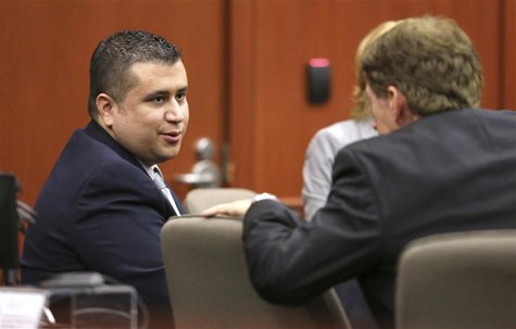 George Zimmerman talks with defense counsel Mark O'Mara at the Seminole County courthouse after a hearing in Sanford, Florida, December 11, George Zimmerman talks with defense counsel Mark O'Mara at the Seminole County courthouse after a hearing in Sanford, Florida, December 11,