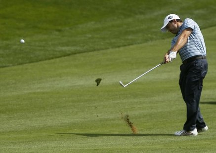 Richard Sterne of South Africa hits a shot from the eighth fairway during the first round of the Dubai Desert Classic at the Emirates Golf C Richard Sterne of South Africa hits a shot from the eighth fairway during the first round of the Dubai Desert Classic at the Emirates Golf C