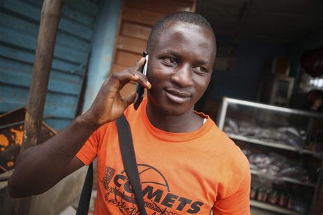 A man makes a call on a mobile phone in Sierra Leone's capital Freetown December 13, 2012. REUTERS/Simon Akam A man makes a call on a mobile phone in Sierra Leone's capital Freetown December 13, 2012. REUTERS/Simon Akam