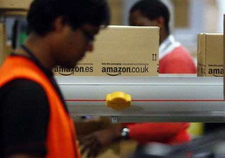 A worker packs boxes at Amazon's logistics centre in Graben near Augsburg December 17, 2012. REUTERS/Michael Dalder A worker packs boxes at Amazon's logistics centre in Graben near Augsburg December 17, 2012. REUTERS/Michael Dalder