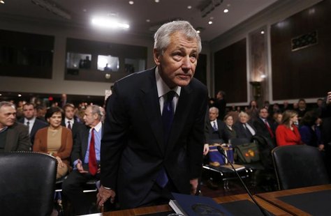 Former Sen. Chuck Hagel (R-NE) (L), sits down before giving testimony to the Senate Armed Services Committee to be Defense Secretary, on Cap Former Sen. Chuck Hagel (R-NE) (L), sits down before giving testimony to the Senate Armed Services Committee to be Defense Secretary, on Cap