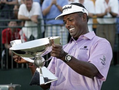 Vijay Singh of Fiji smiles as he looks at the Fedex Cup after the conclusion of the Tour Championship golf tournament at East Lake Golf Club Vijay Singh of Fiji smiles as he looks at the Fedex Cup after the conclusion of the Tour Championship golf tournament at East Lake Golf Club