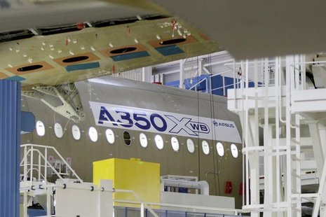 The main body section of the first Airbus A350 is seen on the final assembly line in Toulouse, southwestern France, October 23, 2012. REUTER The main body section of the first Airbus A350 is seen on the final assembly line in Toulouse, southwestern France, October 23, 2012. REUTER