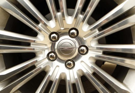 A Chrysler logo is seen on the wheel of a new car at a dealership in Vienna, Virginia April 26, 2012. REUTERS/Kevin Lamarque A Chrysler logo is seen on the wheel of a new car at a dealership in Vienna, Virginia April 26, 2012. REUTERS/Kevin Lamarque