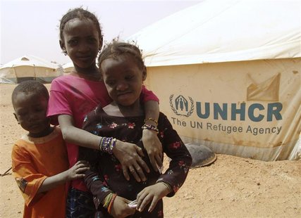 Malian children stand in front of a tent at the refugee camp of Taberey Baraye, some 7km (4 miles) from Ayorou, near the Mali-Niger border J Malian children stand in front of a tent at the refugee camp of Taberey Baraye, some 7km (4 miles) from Ayorou, near the Mali-Niger border J