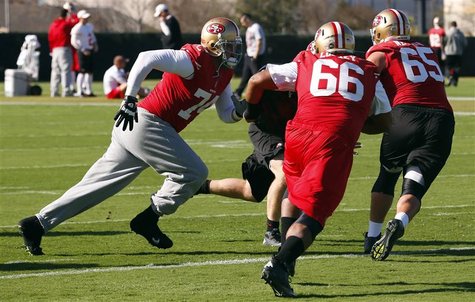 San Francisco 49ers tackle Joe Staley (L), guard Joe Looney (C), and guard Al Netter work on blocking drills during a NFL Super Bowl XLVII f San Francisco 49ers tackle Joe Staley (L), guard Joe Looney (C), and guard Al Netter work on blocking drills during a NFL Super Bowl XLVII f