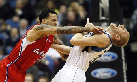 L.A. Clippers' forward Matt Barnes (L) pushes Minnesota Timberwolves' center Greg Stiemsma during the first half of their NBA basketball gam L.A. Clippers' forward Matt Barnes (L) pushes Minnesota Timberwolves' center Greg Stiemsma during the first half of their NBA basketball gam