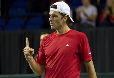 Canada's Frank Dancevic reacts after winning a game against Spain's Marcel Granollers during the first round of the Davis Cup tennis match i Canada's Frank Dancevic reacts after winning a game against Spain's Marcel Granollers during the first round of the Davis Cup tennis match i