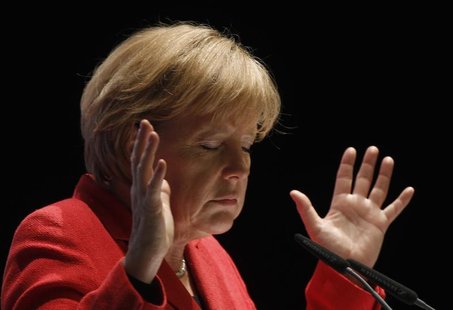 German Chancellor Angela Merkel gestures during a election campaign in the western town of Soest April 26, 2010. REUTERS/Ina Fassbender German Chancellor Angela Merkel gestures during a election campaign in the western town of Soest April 26, 2010. REUTERS/Ina Fassbender
