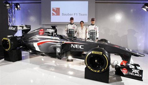Sauber Formula One team principal Monisha Kaltenborn (C) poses with F1 drivers Nico Hulkenberg (L) of Germany and Esteban Gutierrez of Mexic Sauber Formula One team principal Monisha Kaltenborn (C) poses with F1 drivers Nico Hulkenberg (L) of Germany and Esteban Gutierrez of Mexic