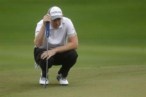 Stephen Gallacher of Scotland lines up his shot at the eighth green during the third round of the Dubai Desert Classic at the Emirates Golf Stephen Gallacher of Scotland lines up his shot at the eighth green during the third round of the Dubai Desert Classic at the Emirates Golf