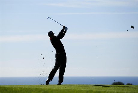 U.S. golfer Tiger Woods hits his second shot off the 17th fairway during final round play at the Farmers Insurance Open in San Diego, Califo U.S. golfer Tiger Woods hits his second shot off the 17th fairway during final round play at the Farmers Insurance Open in San Diego, Califo