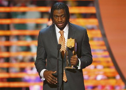 Washington Redskins quarterback Robert Griffin III accepts the the award for the NFL Offensive Rookie of the year during the NFL Honors awar Washington Redskins quarterback Robert Griffin III accepts the the award for the NFL Offensive Rookie of the year during the NFL Honors awar