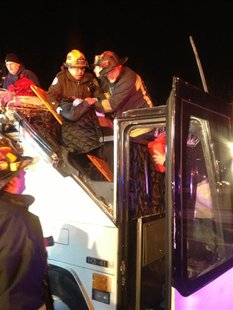 First responders assist injured passensers from a charter bus that crashed in Boston, Massachusettes February 2, 2013. The bus was carrying First responders assist injured passensers from a charter bus that crashed in Boston, Massachusettes February 2, 2013. The bus was carrying