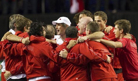 Team Canada's head coach Martin Laurendeau (white cap) celebrates with his team after Canada's Milos Raonic defeated Spain's Guillermo Garci Team Canada's head coach Martin Laurendeau (white cap) celebrates with his team after Canada's Milos Raonic defeated Spain's Guillermo Garci