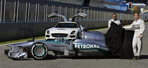 Mercedes Formula One racing driver Lewis Hamilton (L) of Britain and teammate Nico Rosberg of Germany unveil the new Mercedes W04 Formula On Mercedes Formula One racing driver Lewis Hamilton (L) of Britain and teammate Nico Rosberg of Germany unveil the new Mercedes W04 Formula On
