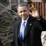 President Barack Obama waves to reporters as he walks across the South Lawn to board the Marine One helicopter for departure to Minnesota, w President Barack Obama waves to reporters as he walks across the South Lawn to board the Marine One helicopter for departure to Minnesota, w