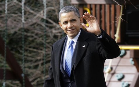 President Barack Obama waves to reporters as he walks across the South Lawn to board the Marine One helicopter for departure to Minnesota, w President Barack Obama waves to reporters as he walks across the South Lawn to board the Marine One helicopter for departure to Minnesota, w