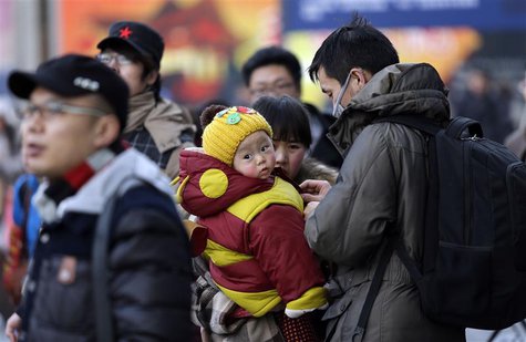 A family arrives at Beijing West Railway Station February 5, 2013. REUTERS/Jason Lee A family arrives at Beijing West Railway Station February 5, 2013. REUTERS/Jason Lee