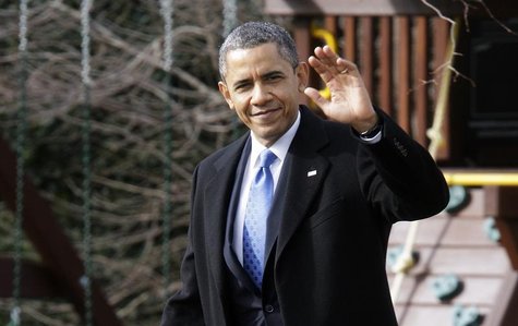 President Barack Obama waves to reporters as he walks across the South Lawn to board the Marine One helicopter for departure to Minnesota fr President Barack Obama waves to reporters as he walks across the South Lawn to board the Marine One helicopter for departure to Minnesota fr