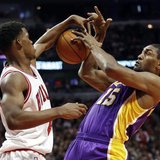 Chicago Bulls small forward Jimmy Butler (L) blocks the shot of Los Angeles Lakers small forward Metta World Peace during the first half of Chicago Bulls small forward Jimmy Butler (L) blocks the shot of Los Angeles Lakers small forward Metta World Peace during the first half of
