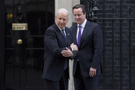 Britain's Prime Minister David Cameron (R) bids farewell to U.S. Vice President Joe Biden at Number 10 Downing Street in London February 5, Britain's Prime Minister David Cameron (R) bids farewell to U.S. Vice President Joe Biden at Number 10 Downing Street in London February 5,