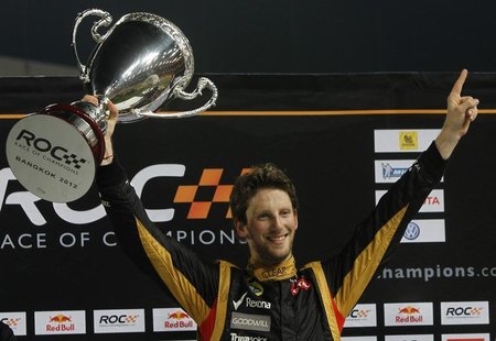 Driver Romain Grosjean from Team France holds up Race of Champions (ROC) trophy after winning over Tom Kristensen from Team All Stars at the Driver Romain Grosjean from Team France holds up Race of Champions (ROC) trophy after winning over Tom Kristensen from Team All Stars at the