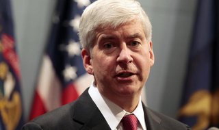 Michigan Governor Rick Snyder holds a news conference to talk about why he signed into law, earlier in the day, right-to-work laws in Lansin Michigan Governor Rick Snyder holds a news conference to talk about why he signed into law, earlier in the day, right-to-work laws in Lansin