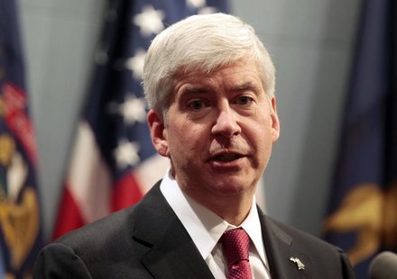 Michigan Governor Rick Snyder holds a news conference to talk about why he signed into law, earlier in the day, right-to-work laws in Lansin Michigan Governor Rick Snyder holds a news conference to talk about why he signed into law, earlier in the day, right-to-work laws in Lansin